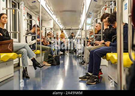 MILAN, ITALY - APRIL 2019 : People in train of subway on April 2019 on metro Milan Stock Photo