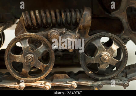 Details of the wheels and tracks of the tractor tracks. Close-up tractor protector with wheel. Vintage industrial background Stock Photo