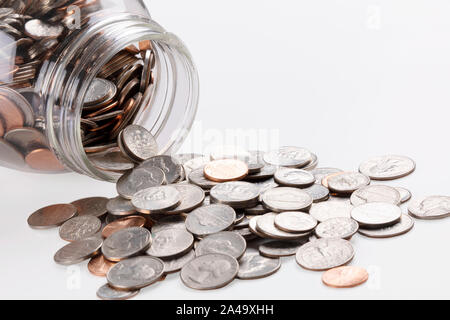 US coins in a jar isolated on white background with copy space Stock Photo