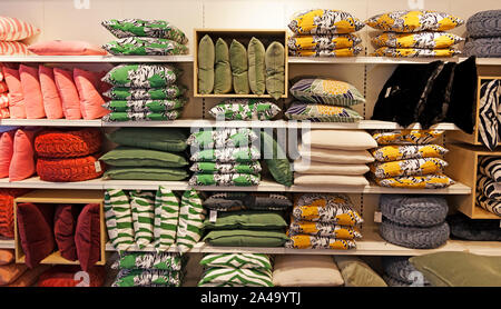 Umea, Sweden - September 5, 2019: lots of different pillows for sale in interior design shop Stock Photo