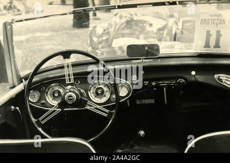 Vintage car steering wheel and dashboard, 1950s Stock Photo