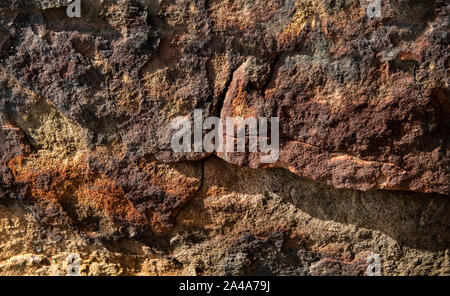 Sedimentary sandstone textured and coloured background Stock Photo