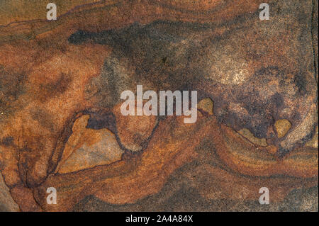 Sedimentary sandstone textured and coloured background Stock Photo