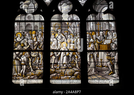 Stained glass window depicting the life of St. Floscel,  Beaune cathedral, France. Stock Photo
