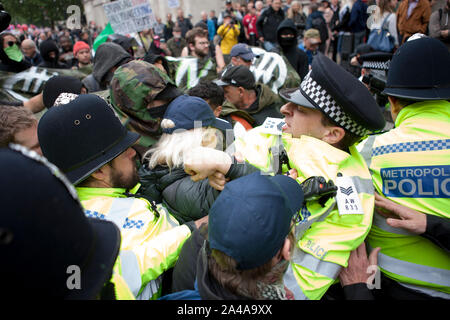 London's Metropolitan Police tackle and arrest antifa supporters at the Anti Trump march in London Stock Photo