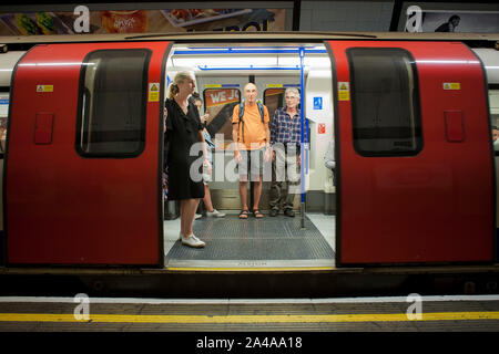two men on London underground tube Stock Photo