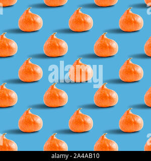 seamless pattern of pumpkins on a blue background, concept of healthy nutrition, vegan food Stock Photo