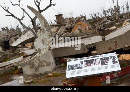 A cartel shows photos of a pizzeria, which used to be part of the tourist city of Villa Epecuen, now a pile of ruins. Buenos Aires province, Arg. Stock Photo