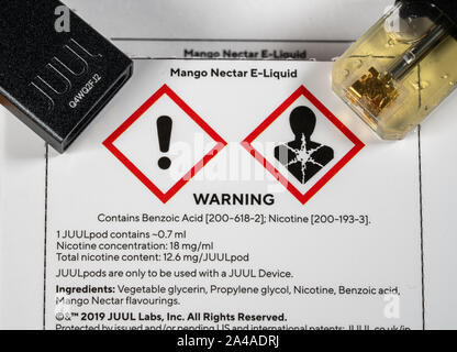 MORGANTOWN, WV - 13 October 2109: Warning sign for Juul e-cigarette or  nicotine vapor dispenser box showing ingredients of the E-Liquid pod Stock  Photo