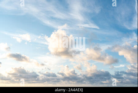 Blue sunset sky with many nice white clouds Stock Photo