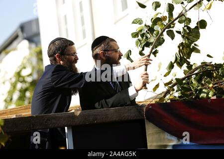 Berlin, Germany. 13th Oct, 2019. Germany, Berlin, 13.10.2019, Yehuda Teichtal and Samuel Segal at the inauguration of the Sukka. On Sunday, October 13, 2019, begins Sukkot, the Jewish Feast of Tabernacles. The seven-day festival is on the grounds of the Jewish Education Center Berlin. For the duration of the Sukkot holidays, all meals are taken together in the sukkah (tabernacle). (Photo by Simone Kuhlmey/Pacific Press) Credit: Pacific Press Agency/Alamy Live News Stock Photo