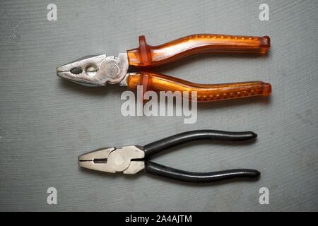 Pliers on a stone table Stock Photo