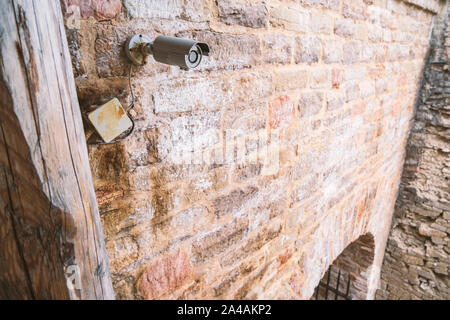 Modern video surveillance system on the wall of an old fortress. Close-up. Stock Photo