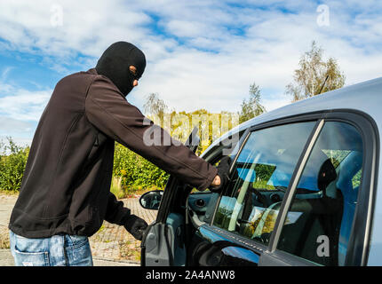 car thief in action Stock Photo