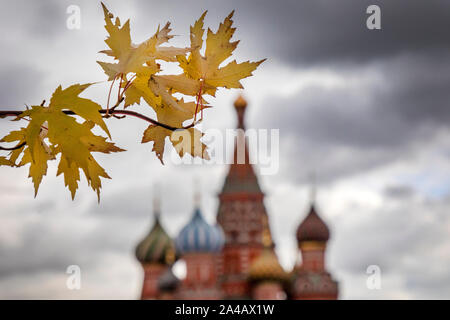 Autumn leaves on the background of St. Basil's Cathedral on Red square in the center of Moscow, Russia Stock Photo