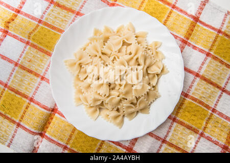 Fresh cooked farfalle pasta, served in dish without sauce Stock Photo