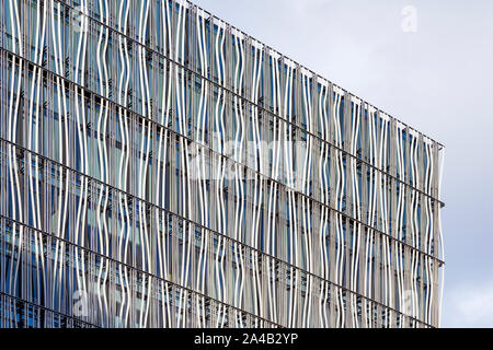 Closeup View Of Curved Louvers Cover Facade Of Building And It Creates Extra Shadows. Stock Photo