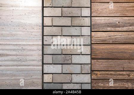 The Textured Wall by Concrete Brick, Timber Boards and the Natural Stone Grey Color Panel. Stock Photo