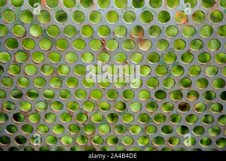 Perforated metal sheet photographed as a background Stock Photo