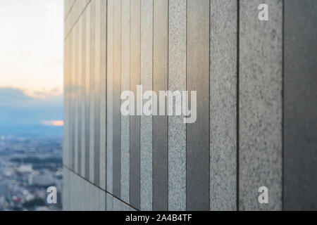 Texture of Polished Stone Panels. Two Shades of Grey Granite Tiles and Reflection Sunset on the Background. Stock Photo