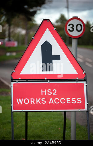 High Speed Two (HS2) Works Access warning sign. This sign, and other similar signs, are being used to identify access points for HS2 related traffic from roads close to its planned route. These particular signs were placed on the B4010 road at Stoke Mandeville, Buckinghamshire, adjacent to Stoke House Farm. High Speed Two (HS2) is the planned high speed rail network connecting London with the West Midlands ('Phase One'), in 2026 and with Manchester and Leeds ('Phase Two') in 2033. Credit: Stephen Bell/Alamy Stock Photo