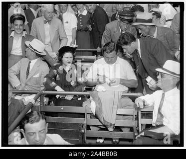 Although out of baseball for the last few years, Babe Ruth still retains  his popularity with the millions of baseball fans the country over. With  Mrs. Ruth the Babe is shown autographing