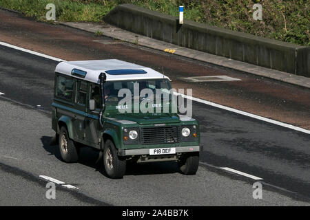 1997 90s green Land Rover 110 Defender County Swtdi; traveling on the M6 motorway near Preston in Lancashire, UK Stock Photo