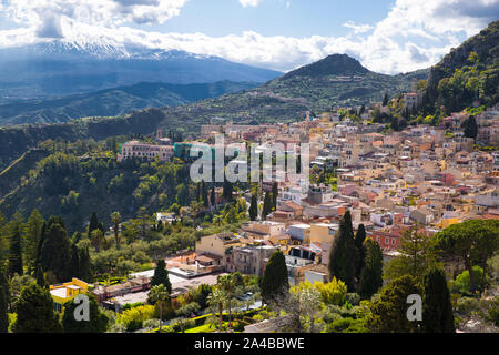 Etna volcano and Taormina town aerial panoramic view. Roofs of a lot of buldings. Sicily island, Italy. Stock Photo