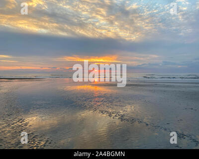 Sunset on the beach in Zandvoort. It is a popular beach destination located near to Amsterdam, with clean sandy beaches, popular beach bars and family Stock Photo