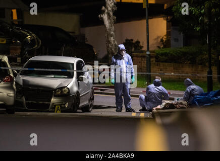 Police forensics officers at the scene of a fatal stabbing on Barnehurst Avenue, in Bexley, south east London. The 20-year-old man who died after he was stabbed in the chest was London's sole knife crime fatality over the weekend. Stock Photo