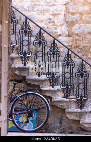 Down a quiet side street in Old Town Budva, Montenegro is an ornate staircase Stock Photo