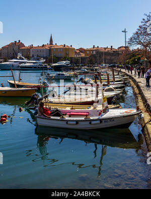 March 23, 2019 - Budva, Montenegro - Water taxis line the boardwalk near Old Town Budva, ready to take tourists to the surrounding islands Stock Photo