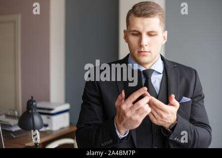 Displeased businessman doing cold calls Stock Photo