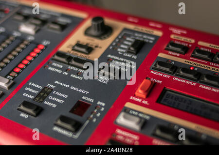 Red, classic stage synthesizer, famous for its sounds and style, with a large keypad for control and choice of the sound to be launched live. Stock Photo