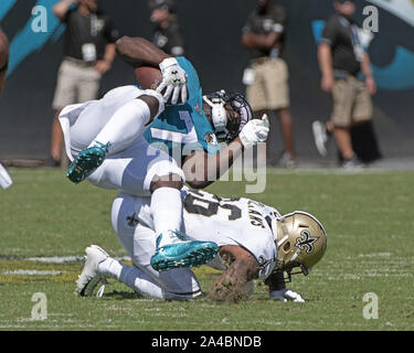 Jacksonville, United States. 13th Oct, 2019. Jaguars Running Back Leonard Fournette (27) is tackled as the New Orleans Saints play the Jacksonville Jaguars at the TIAA Bank Field in Jacksonville, Florida on Sunday, October 13, 2019. The Saints defeated Jacksonville 13-6. Photo by Joe Marino/UPI Credit: UPI/Alamy Live News Stock Photo