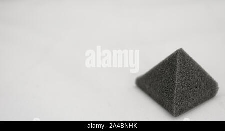 Foam pyramid isolated on white background Stock Photo