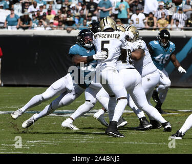 Jacksonville, United States. 13th Oct, 2019. Saints Quarterback Teddy Bridgewater passes under pressure during the first quarter as the New Orleans Saints play the Jacksonville Jaguars at the TIAA Bank Field in Jacksonville, Florida on Sunday, October 13, 2019. The Saints defeated Jacksonville 13-6. Photo by Joe Marino/UPI Credit: UPI/Alamy Live News Stock Photo