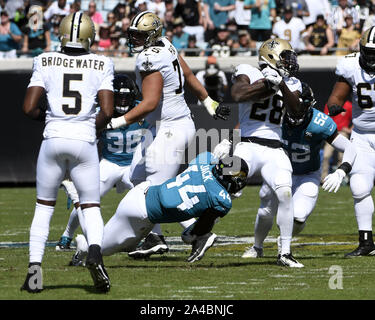 Jacksonville, United States. 13th Oct, 2019. Saints Riunning Back Latavius Murray (28) is tackled during the first quarter as the New Orleans Saints play the Jacksonville Jaguars at the TIAA Bank Field in Jacksonville, Florida on Sunday, October 13, 2019. The Saints defeated Jacksonville 13-6. Photo by Joe Marino/UPI Credit: UPI/Alamy Live News Stock Photo