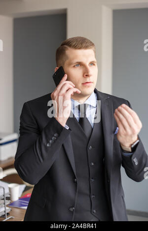Businessman disputing on the phone Stock Photo