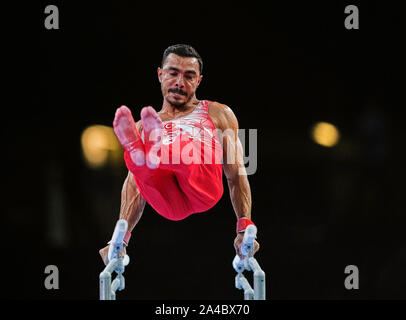 Stuttgart, Germany. 13th Oct, 2019. Ferhat Arican of Turkey competing in parallel bars for men during the 49th FIG Artistic Gymnastics World Championships at the Hanns Martin Schleyer Halle in Stuttgart, Germany. Ulrik Pedersen/CSM/Alamy Live News Stock Photo