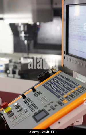 Modern milling machine with CNC control panel in the foreground. Selective focus. Stock Photo