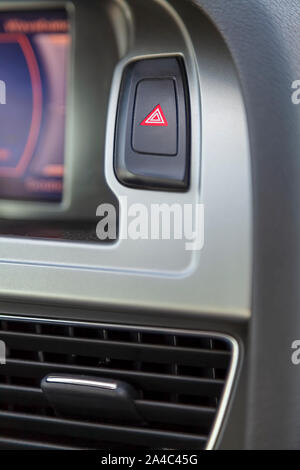Hazard warning lights, the emergency stop button in the car Stock Photo
