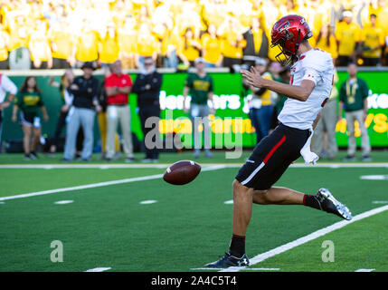 Waco, Texas, USA. 12th Oct, 2019. Texas Tech Red Raiders place kicker Austin McNamara (31) punts the ball during the 2nd half of the NCAA Football game between Texas Tech Red Raiders and the Baylor Bears at McLane Stadium in Waco, Texas. Matthew Lynch/CSM/Alamy Live News Stock Photo