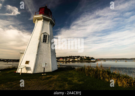 Mulholland Point navigation light and Town of Lubec, Maine   Welshpool, Campobello Island, New Brunswick, CA Stock Photo