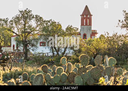 The abandoned ruins of the former Santa Brigida Hacienda in the ghost town of Mineral de Pozos, Guanajuato, Mexico. The town, once a major silver mining center was abandoned and left to ruin but has slowly comeback to life as a bohemian arts community. Stock Photo