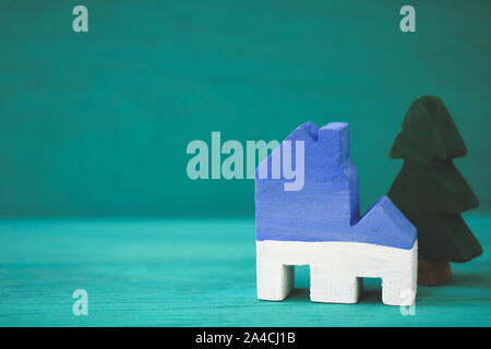 House and tree on green background Stock Photo