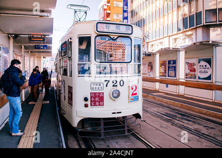 DEC 2, 2018 Hakodate, JAPAN - Hakodate city tram vintage streetcar at station near JR train station. The Tram well-established network throughout the Stock Photo