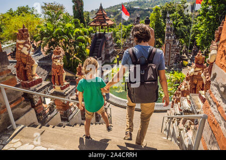 Dad and son tourists in budhist temple Brahma Vihara Arama Banjar Bali, Indonesia. Honeymoon Stock Photo