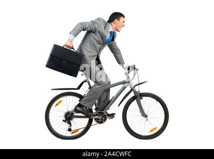 Businessman on bike hurry to work Stock Photo