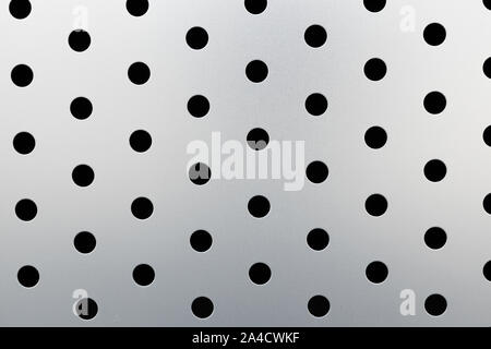 A set of numbers (1234567890), silver metal perforated with small holes  isolated on white background close-up Stock Photo - Alamy